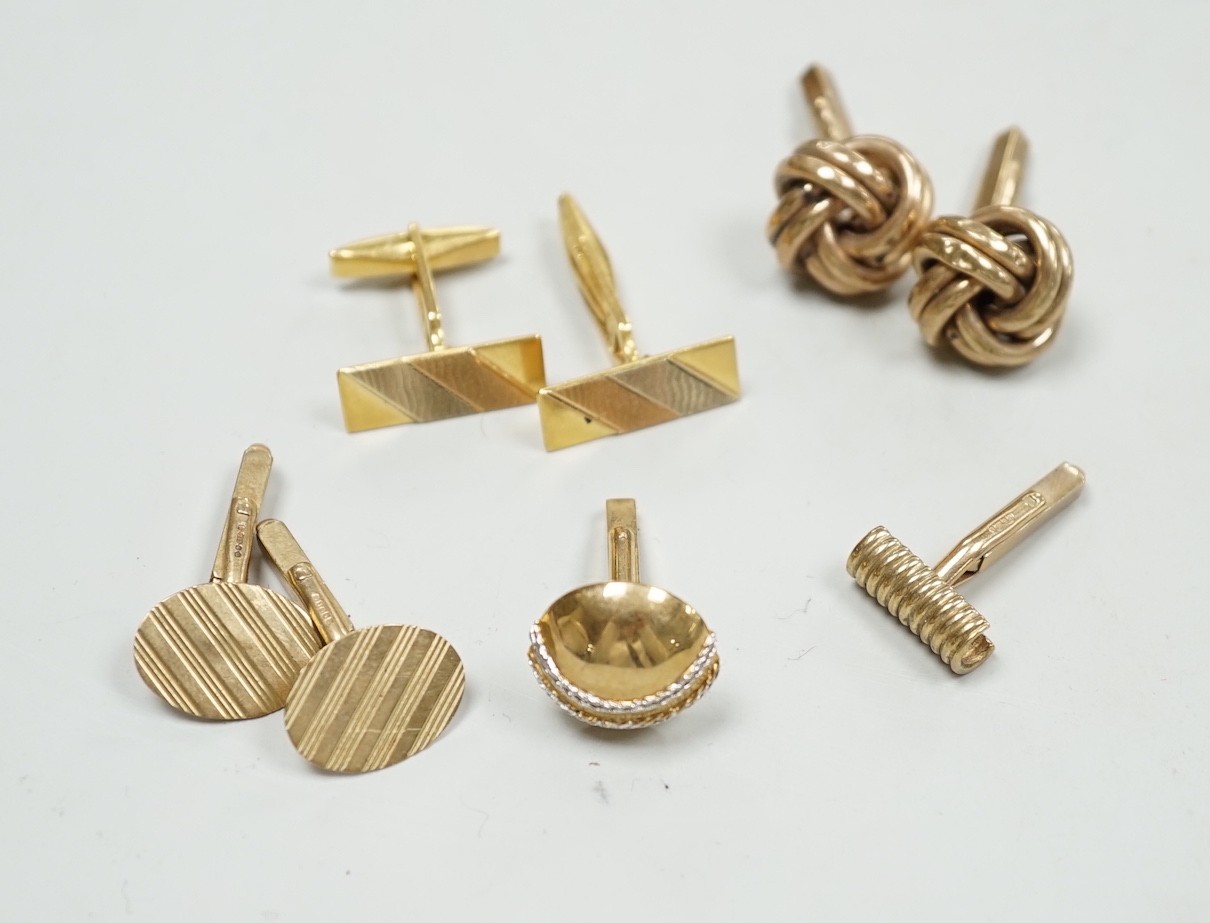 A modern three colour 750 pair of cufflinks, 9.2 grams, a pair of 9ct gold oval cufflinks one other 9ct gold pair and two odd 9ct gold cufflinks, 20.7 grams.